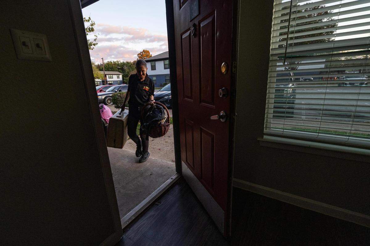 Carol Rogers begins to move her belongings into her new apartment in Saginaw on Tuesday, Nov. 21, 2023. For about four years, Rogers and her daughter-in-law Amber have been living in low-cost hotels, motels and even storage units.