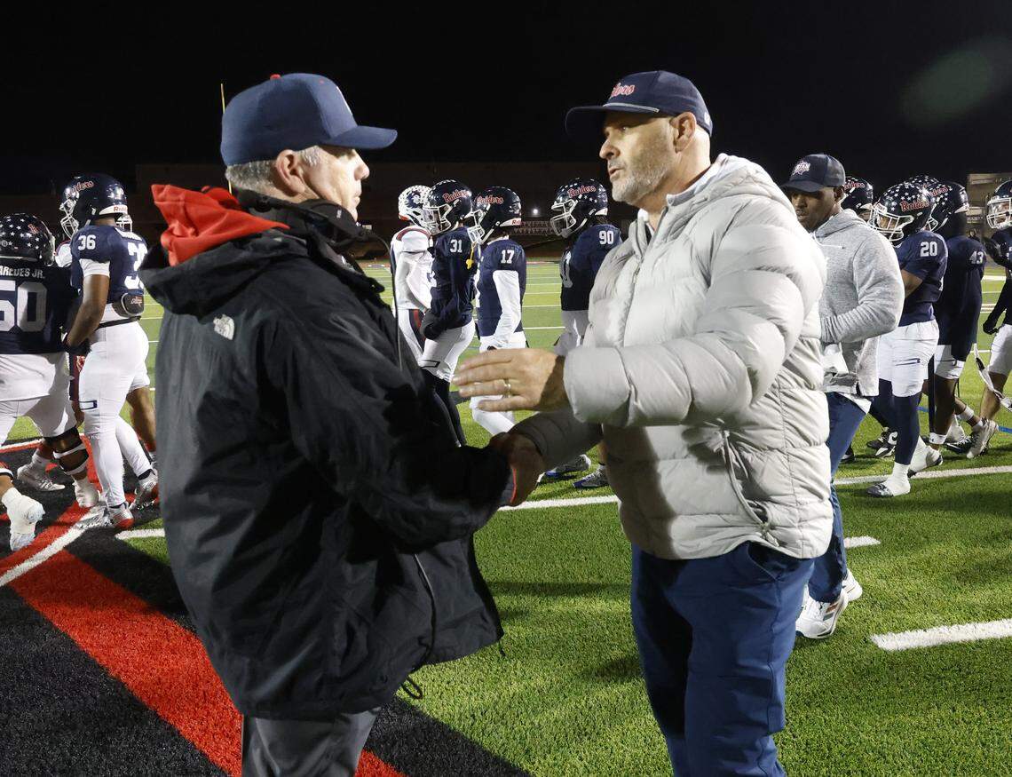 Richland head coach Ged Kates and Denton Ryan head coach Dave Henigan meet at mid field after a UIL Class 5A Division I Regional on Friday Nov. 28, 2025 at Buddy Echols Field in Coppell, Texas.