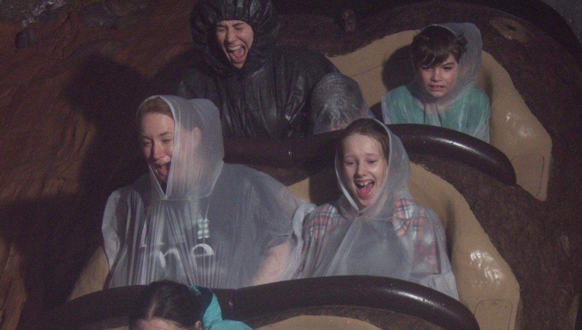 Andrea Lutrell (top left) and her son ride the Disney World log flume in Dec. 2019.
