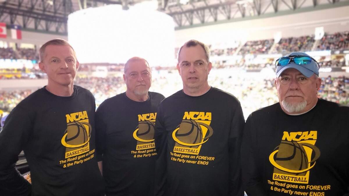 Longtime friends from North Carolina (from left) Ricky Joines, Dean Shepard, Randy Joines, and Buddy Parsons have been attending the NCAA Tournament together every year since 1988. The chose Fort Worth when they purchased tickets in October without knowing, of course, that the North Carolina Tarheels would be playing at Dickies Arena. Two of them are hardcore Tarheels fans. The other two follow North Carolina State and Wake Forest.