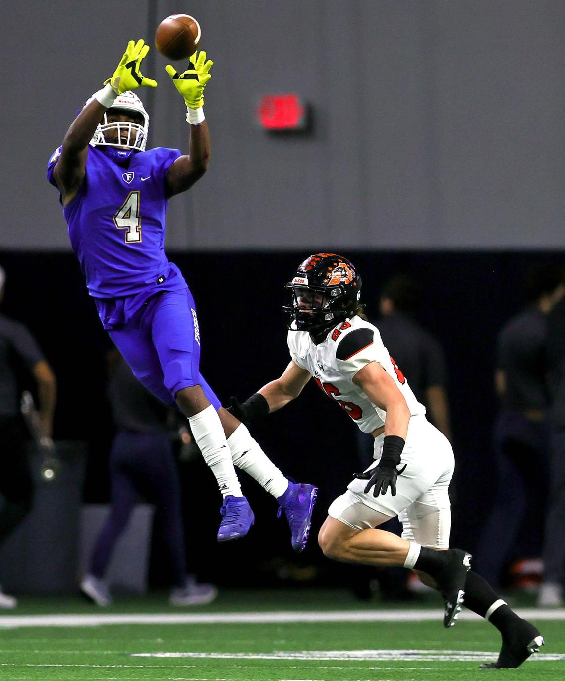 Frisco receiver Chase Lowery (4) goes up for a reception against Aledo defensive back Sammy Steffe (26) during the first half of the 5A Division II Regional round high school football playoffs, December 24, 2020, played at The Ford Center at the Star in Frisco, Tx. (Steve Nurenberg Special to the Star-Telegram)