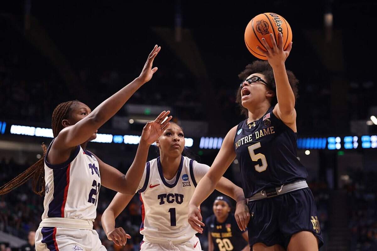 BIRMINGHAM, ALABAMA - MARCH 29: Olivia Miles #5 of the Notre Dame Fighting Irish takes a shot against Agnes Emma-Nnopu #21 and Taylor Bigby #1 of the TCU Horned Frogs during the second halfin the Sweet Sixteen round of the NCAA Women's Basketball Tournament at Legacy Arena at the BJCC on March 29, 2025 in Birmingham, Alabama. (Photo by Sarah Stier/Getty Images)