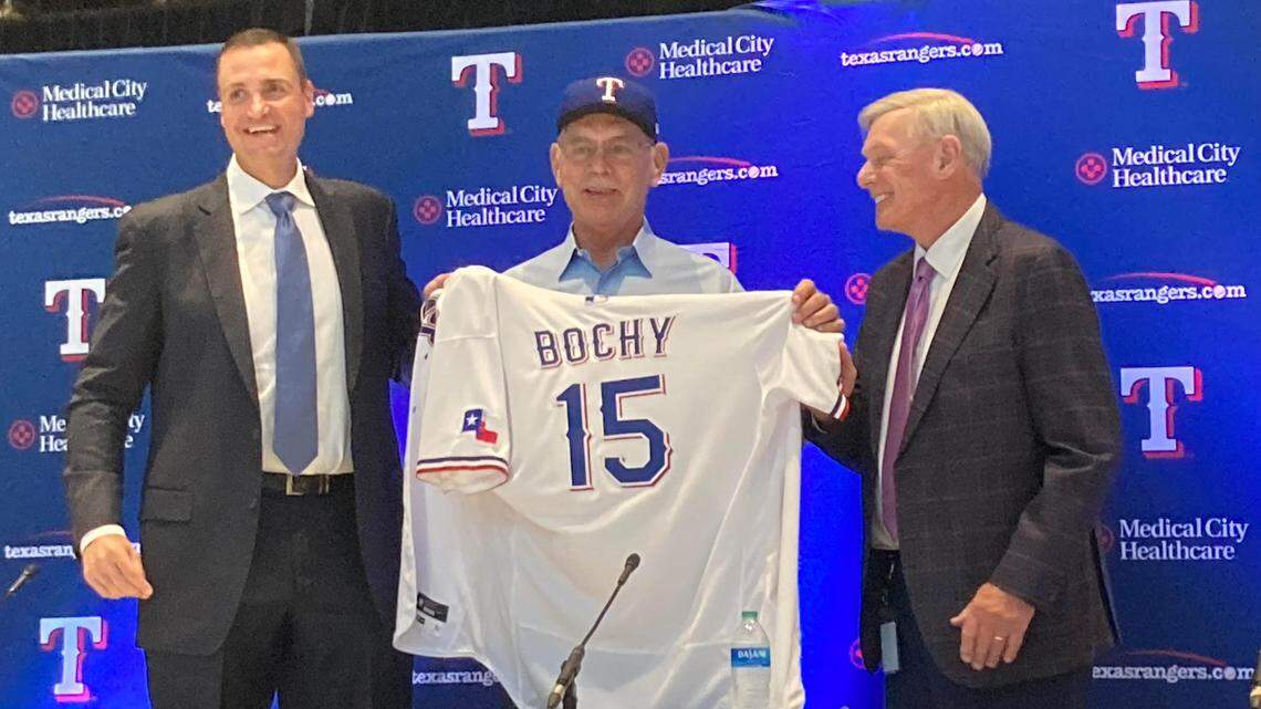 Texas Rangers GM Chris Young (left) introduced Bruce Bochy as the team’s new manager on Monday with owner Ray Davis (right).