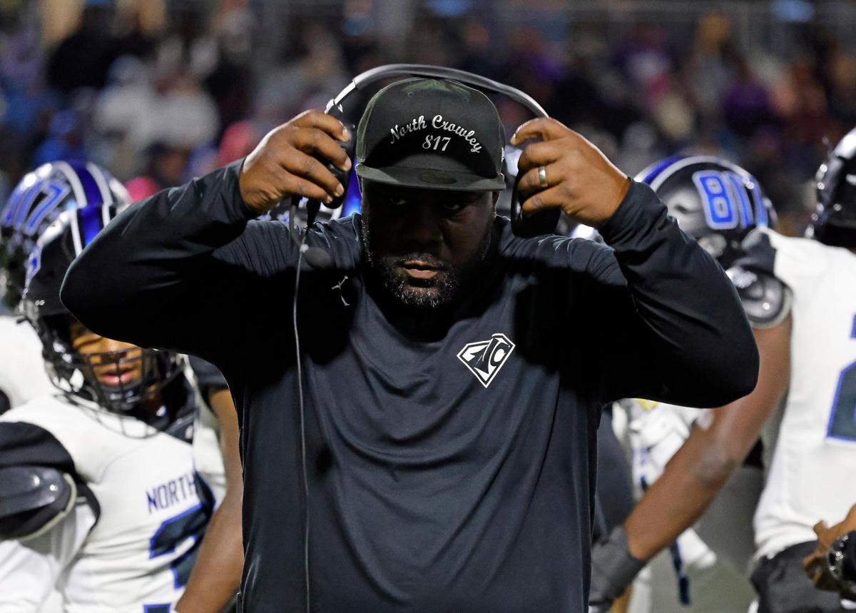 North Crowley head coach Ray Gates adjusts his headphones after a timeout the first half of a UIL high school football game at Crowley ISD Multi-Purpose Stadium in Fort Worth, Texas, Thursday, Nov. 02, 2023.
