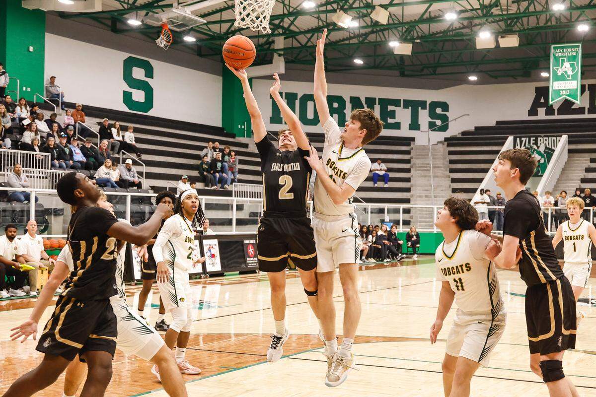 Eagle Mountain’s Cade Renfro (2) goes up for two against Benbrook in a Class 4A Division 2 bi-district game on Monday, February 17, 2025 at Azle High School. Eagle Mountain won 60-48.