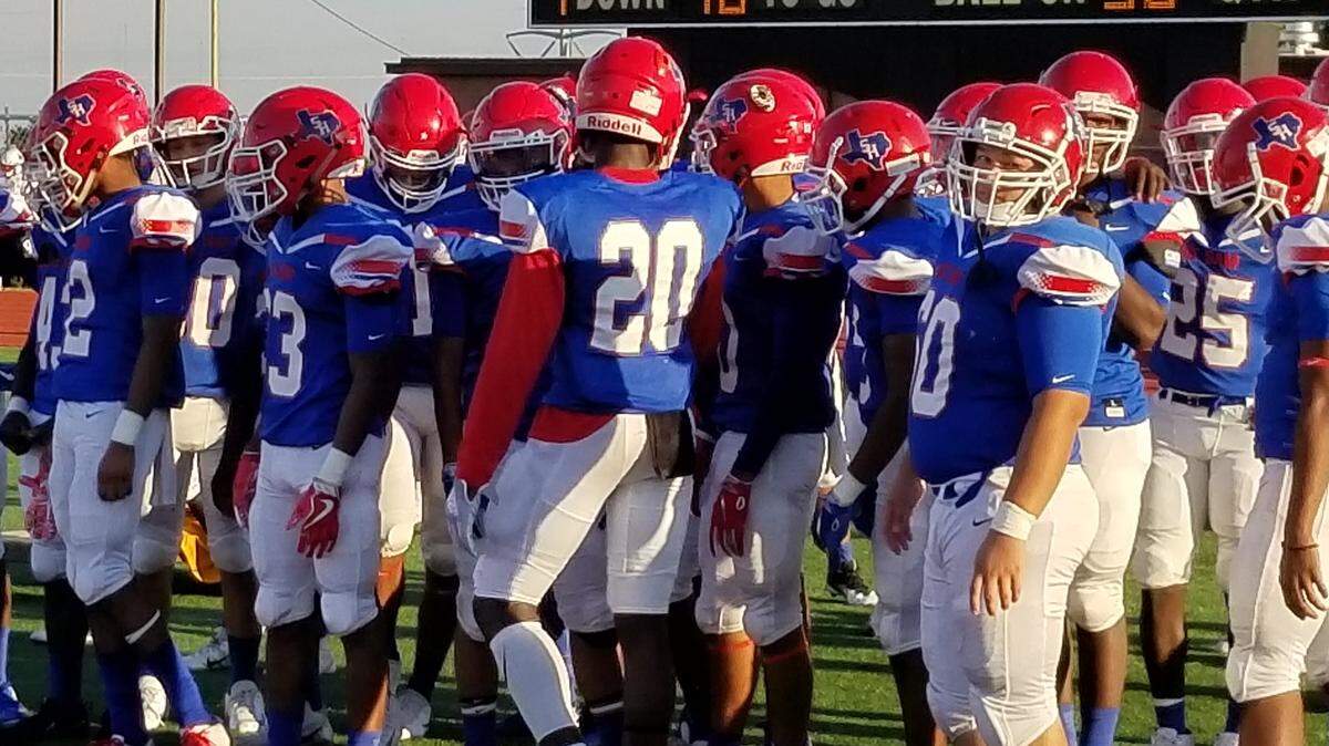 Arlington Sam Houston huddling before the start of their game with Dallas Skyline.