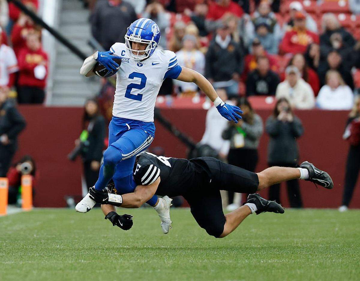 AMES, IA - OCTOBER 25: Linebacker Kooper Ebel #47 of the Iowa State Cyclones tackles wide receiver Chase Roberts #2 of the BYU Cougars as he rushed for yards in the second half of play at Jack Trice Stadium on October 25, 2025, in Ames, Iowa. The BYU Cougars won 41-27 over the Iowa State Cyclones. (Photo by David Purdy/Getty Images)