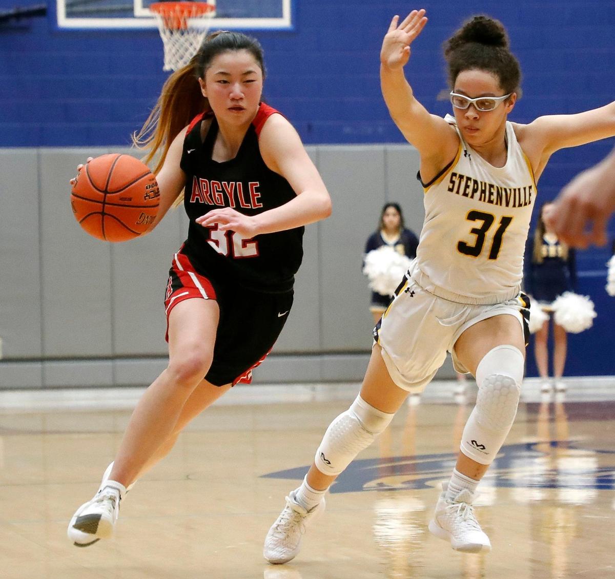 Argyle’s Madi Lumsden races Stephenville’s Mya Wesley to the paint during a high school 4A Region 1 Area Round playoff basketball game at Weatherford High School in Weatherford, Texas, Thursday, Feb. 11, 2022. Argyle defeated Stephenville 56-41. (Special to the Star-Telegram Bob Booth)