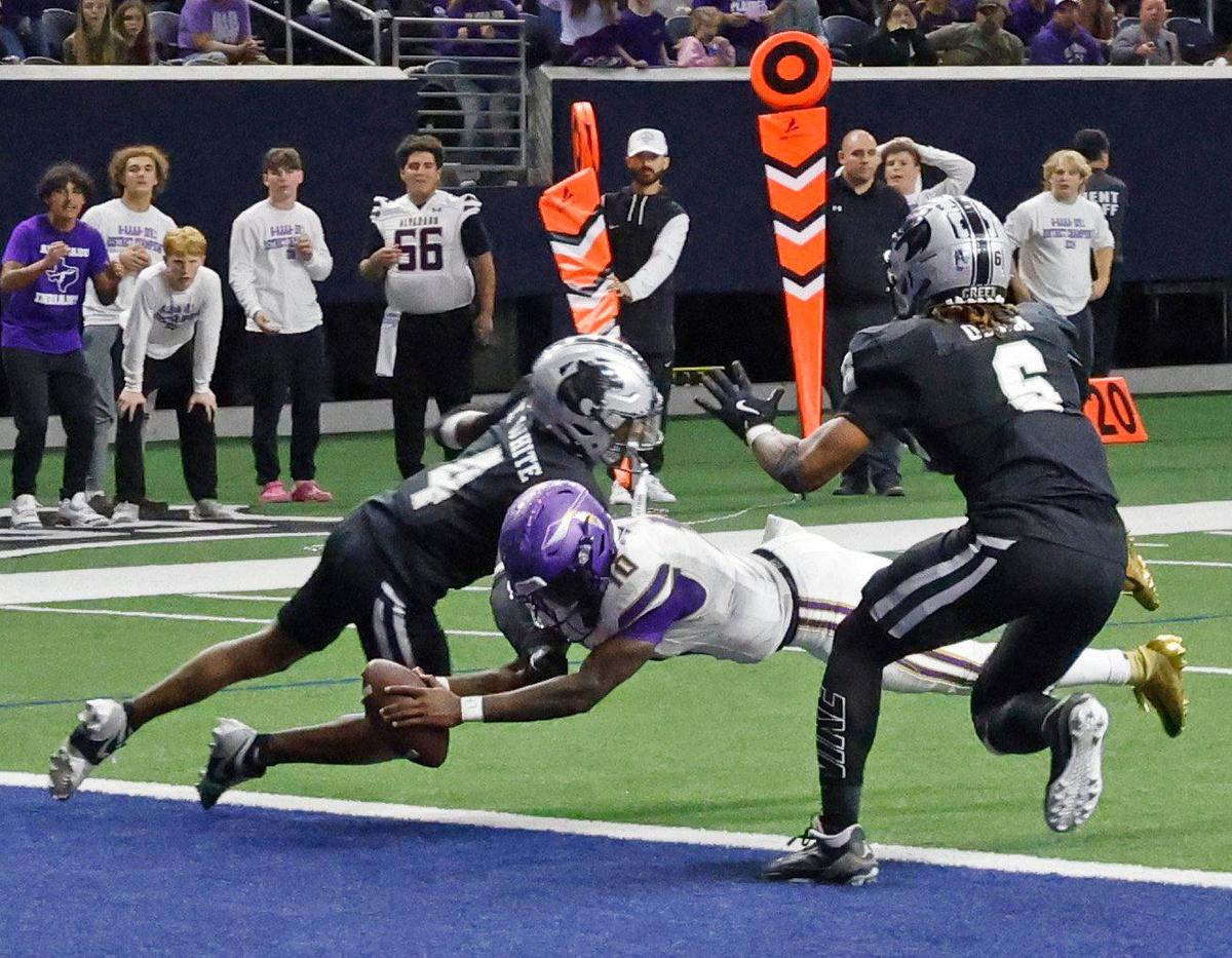 Alvarado quarterback Cardea Collier (10) dives in for the first score in overtime during a UIL 4A D1 Area round football playoff game at The Ford Center in Frisco Texas, Thursday, Nov. 21, 2024.