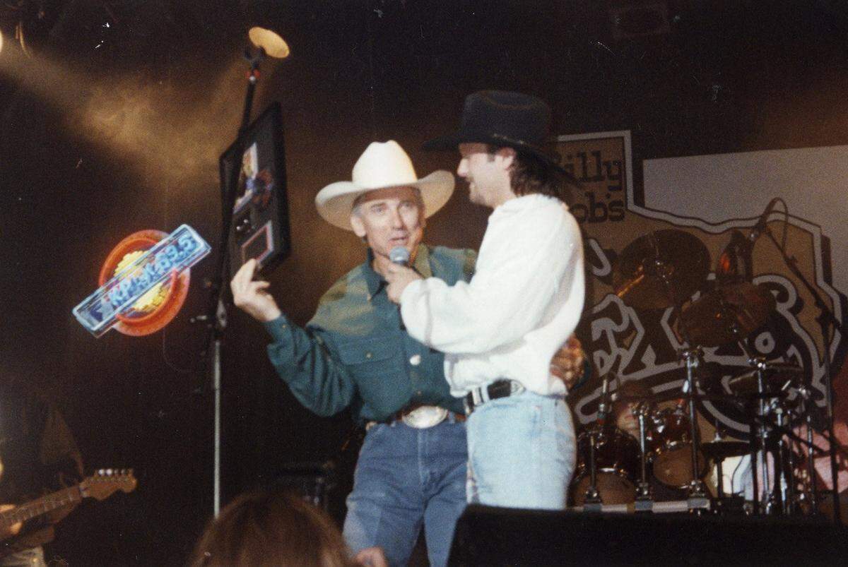 May 27, 1994: Tim McGraw presents Billy Minick with a platinum album at Billy Bob’s Texas.