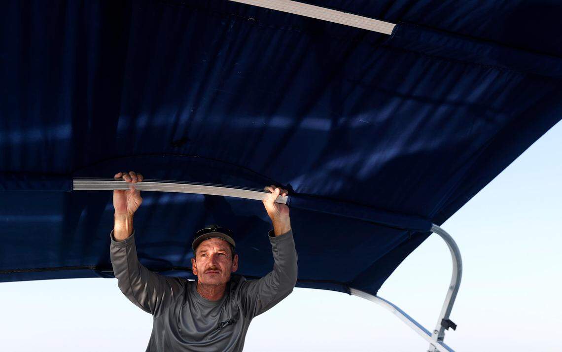 Jason Burns keeps a lookout for the third and final submerged car in Benbrook Lake on Monday, September 16, 2019. For years Rusty Arnold has been searching for his sister, Rachel Trlica, who went missing in 1974. With the help of North Texas Marine Salvage & Recovery’s dive team, he has raised two of the cars to check if they were connected to his sister’s disappearance.