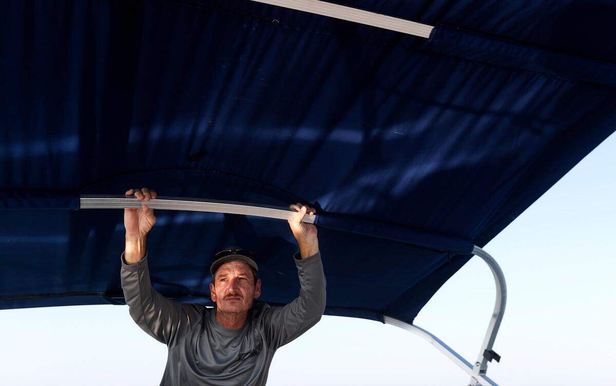 Jason Burns keeps a lookout for the third and final submerged car in Benbrook Lake on Monday, September 16, 2019. For years Rusty Arnold has been searching for his sister, Rachel Trlica, who went missing in 1974. With the help of North Texas Marine Salvage & Recovery’s dive team, he has raised two of the cars to check if they were connected to his sister’s disappearance.
