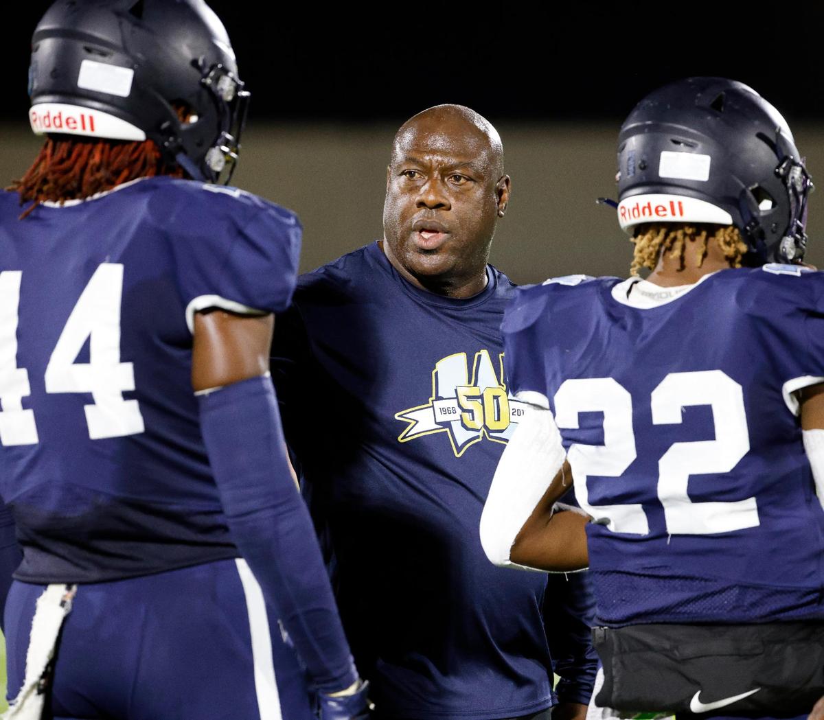 Wyatt’s head coach Zachary Criss talks to players during a time out in the first half of a UIL football game at Clark Stadium in Fort Worth, Texas, Friday, Sept. 29, 2023.