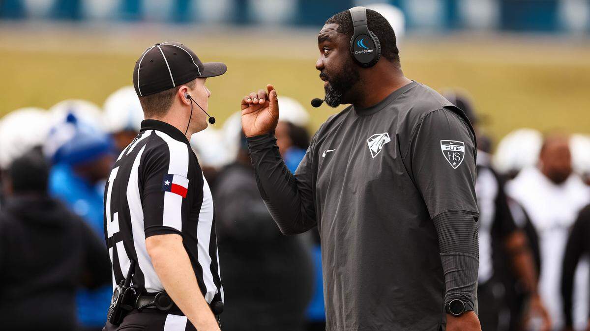 North Crowley head coach Ray Gates talks to an official on the sideline during a Class 6A Division I regional playoff against Coppell on Nov. 29 at Midlothian ISD Stadium in Midlothian.