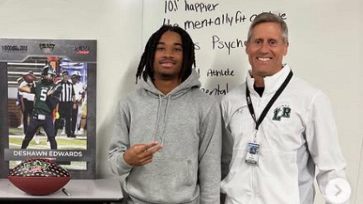 Mansfield Lake Ridge’s DeShawn Edwards (left), shown with head football coach Kirk Thor, ignited a turnaround for the football program as a quarterback. As a point guard, he led the basketball team to the UIL playoffs.
