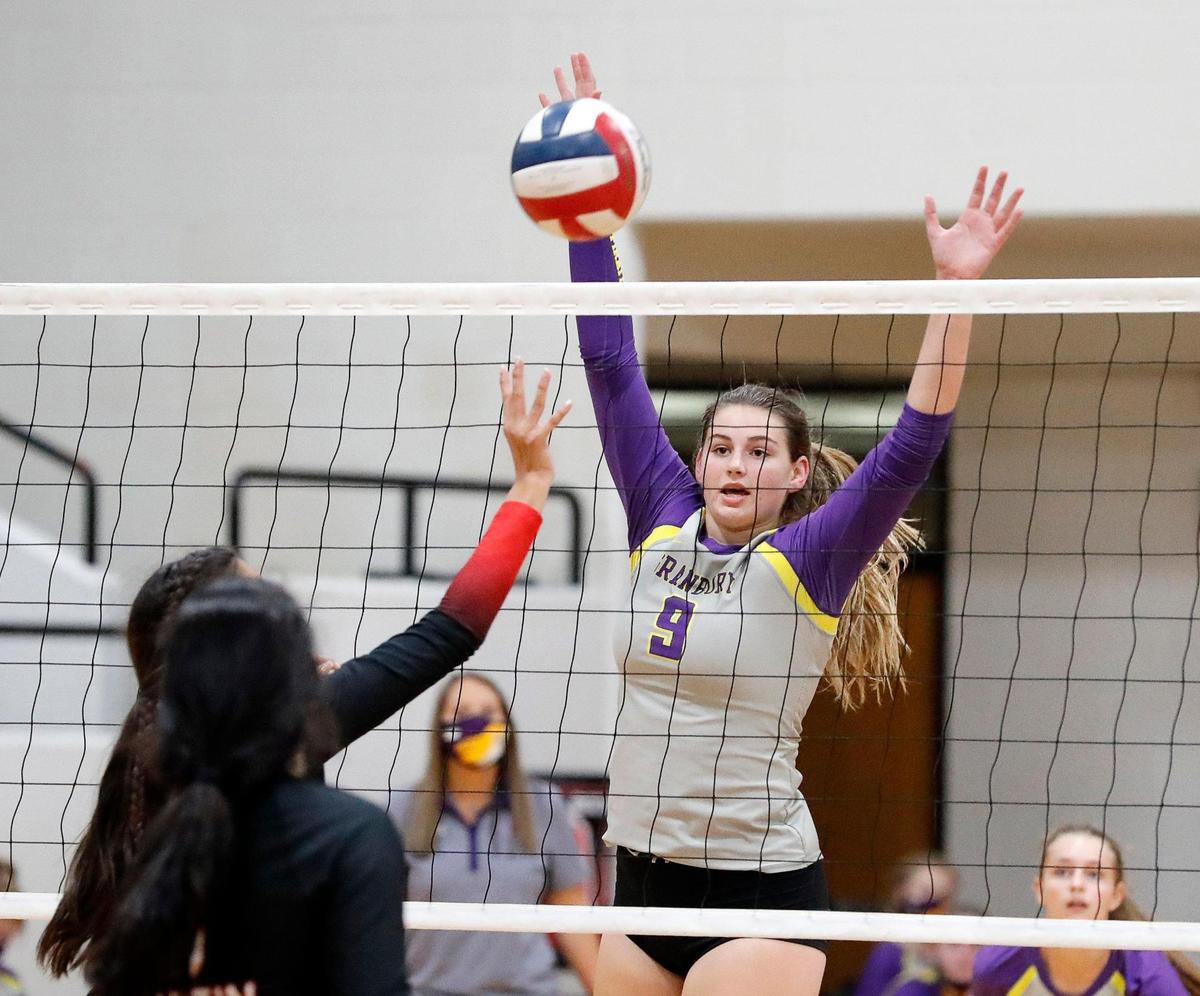 Granbury’s Ellie Alexander attempts to block a shot during a high school volleyball match at Martin High School in Arlington, Texas, Tuesday, Sept. 29, 2020. Martin Lady Warriors defeated the Granbury Lady Pirates in three straight sets. (Special to the Star-Telegram Bob Booth)