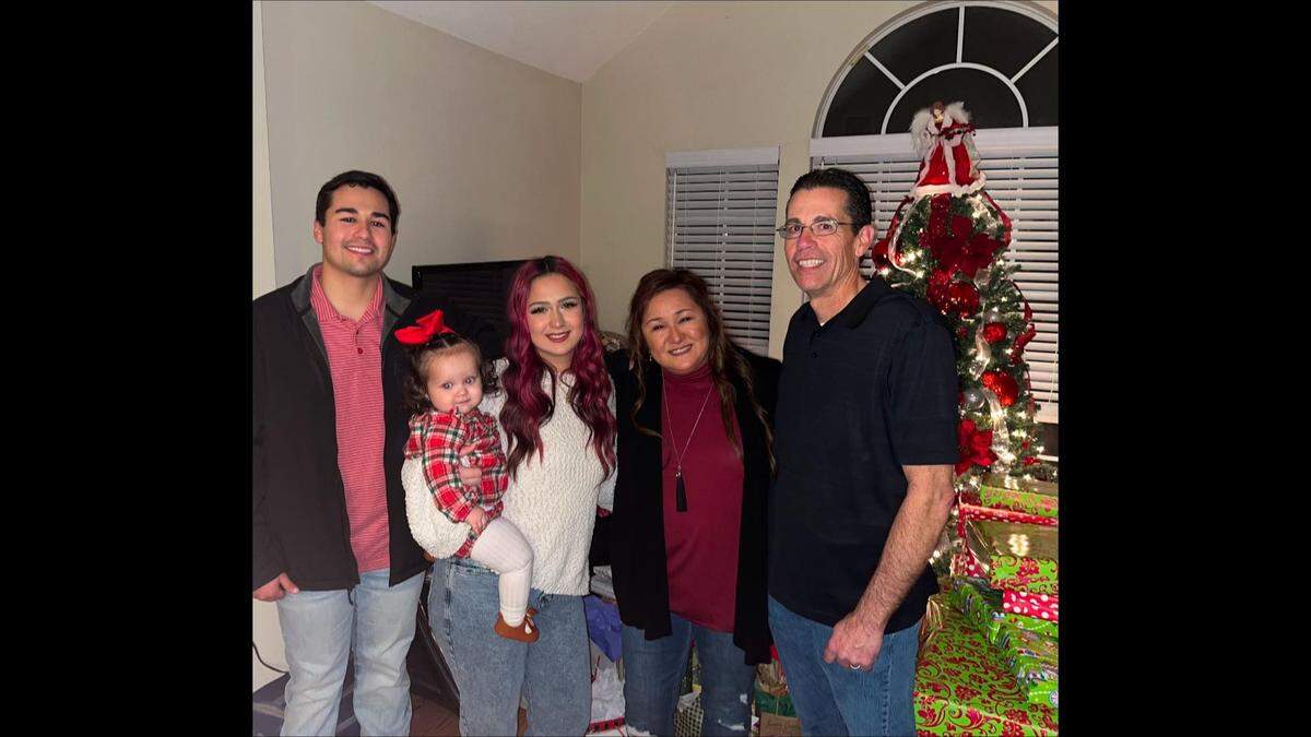 Seth (left) is pictured in a Christmas photo with his niece, Athena, his sister, Ava, his mother, Cyndi, and his father, Clint.