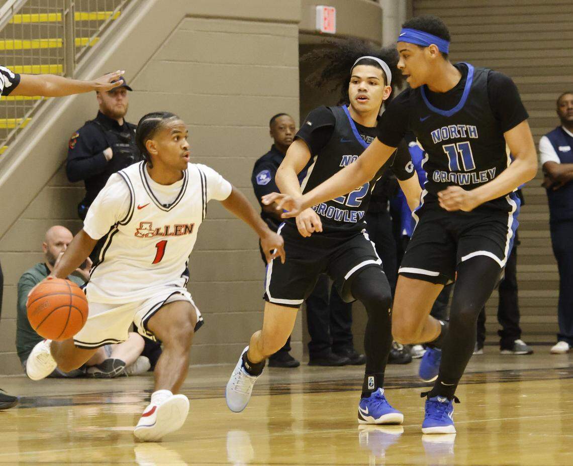 North Crowley guard Isaak Hayes (22) and wing Trey Hall (11) box in Allen's Nehemiah Lawrence (1) during the first half of a UIL Class 6A Division I boys regional final basketball game at Thomas Coliseum in Haltom City, Texas, Friday, Mar. 06, 2026.