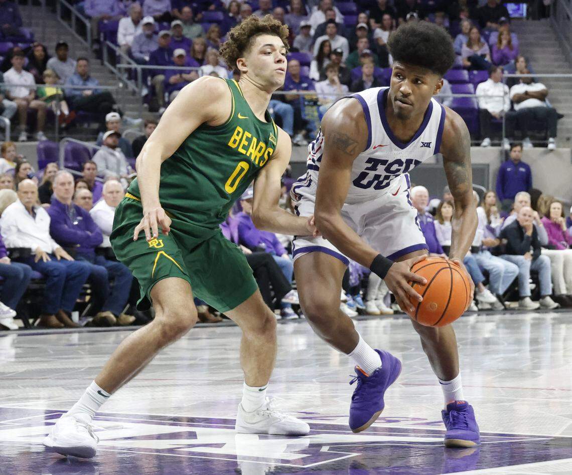 TCU guard Jace Posey (00) enters the key against Baylor guard Dan Skillings Jr. (0) during the second half of a NCAA basketball game between Baylor University and TCU at Schollmaier Arena in Fort Worth, Texas, Saturday Jan. 03, 2026
