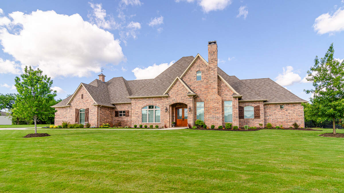 The home at 7961 Bella Flora Drive is situated on 1.8 acres.