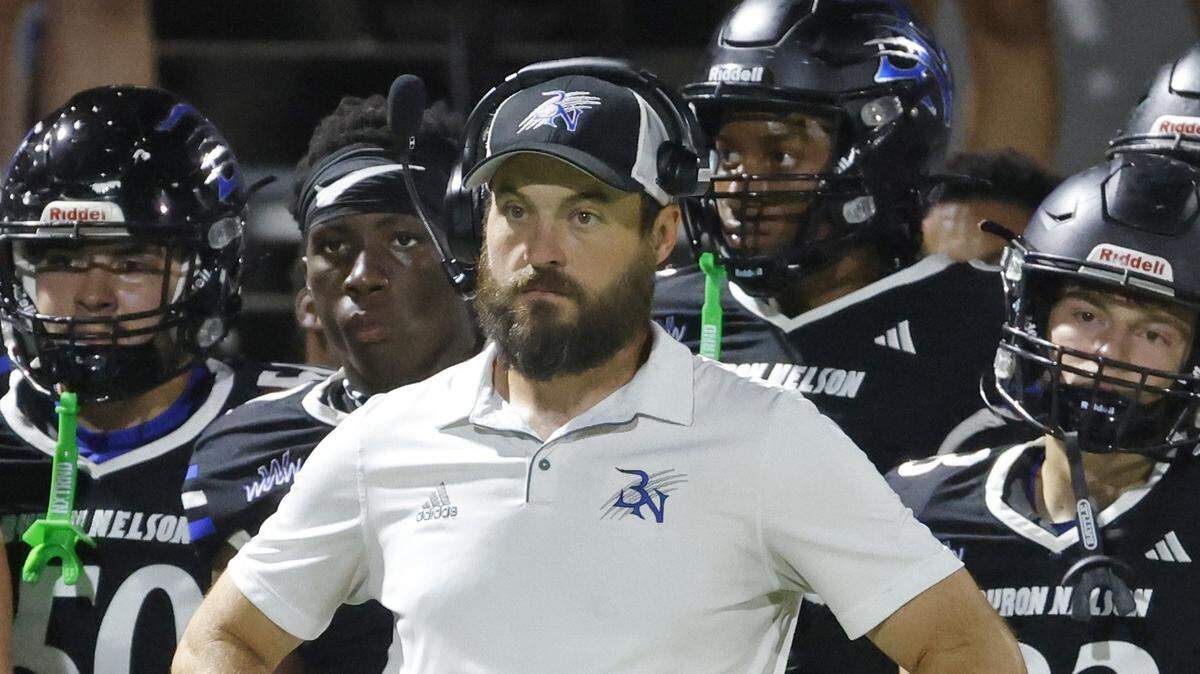 Byron Nelson head coach Zach Woodward watches the final minutes of the second half of a UIL football game between Southlake Carroll and Byron Nelson at Northwest ISD Stadium in Justin, Texas, Friday, Sept. 12, 2025.