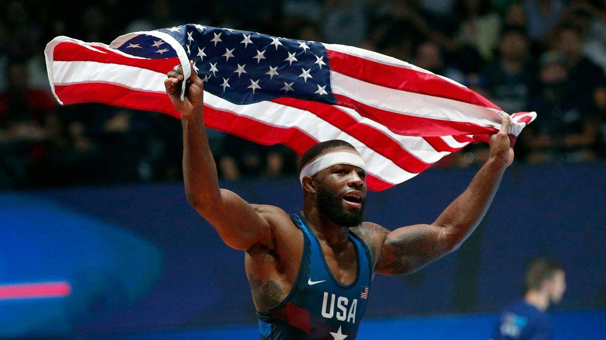 United States’ Jordan Ernest Burroughs celebrates after defeating Khetik Tsabolov, of Russia, in the men’s freestyle 74-kg category during the final of the Wrestling World Cup in Paris in Aug. 2017. The U.S. Wrestling Team Olympic Team Trials will be held at Dickies Arena April 2-3.
