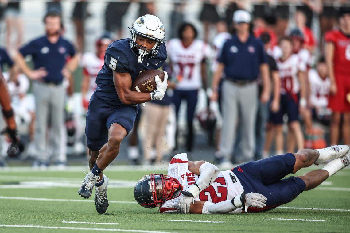 Keller running back Quintin Shropshire gets gets past Northwest High School’s Brandon Rodriguez  in Friday’s District 4-6A game at Keller ISD Stadium. Tom Marvin / Special to the Star-Telegram