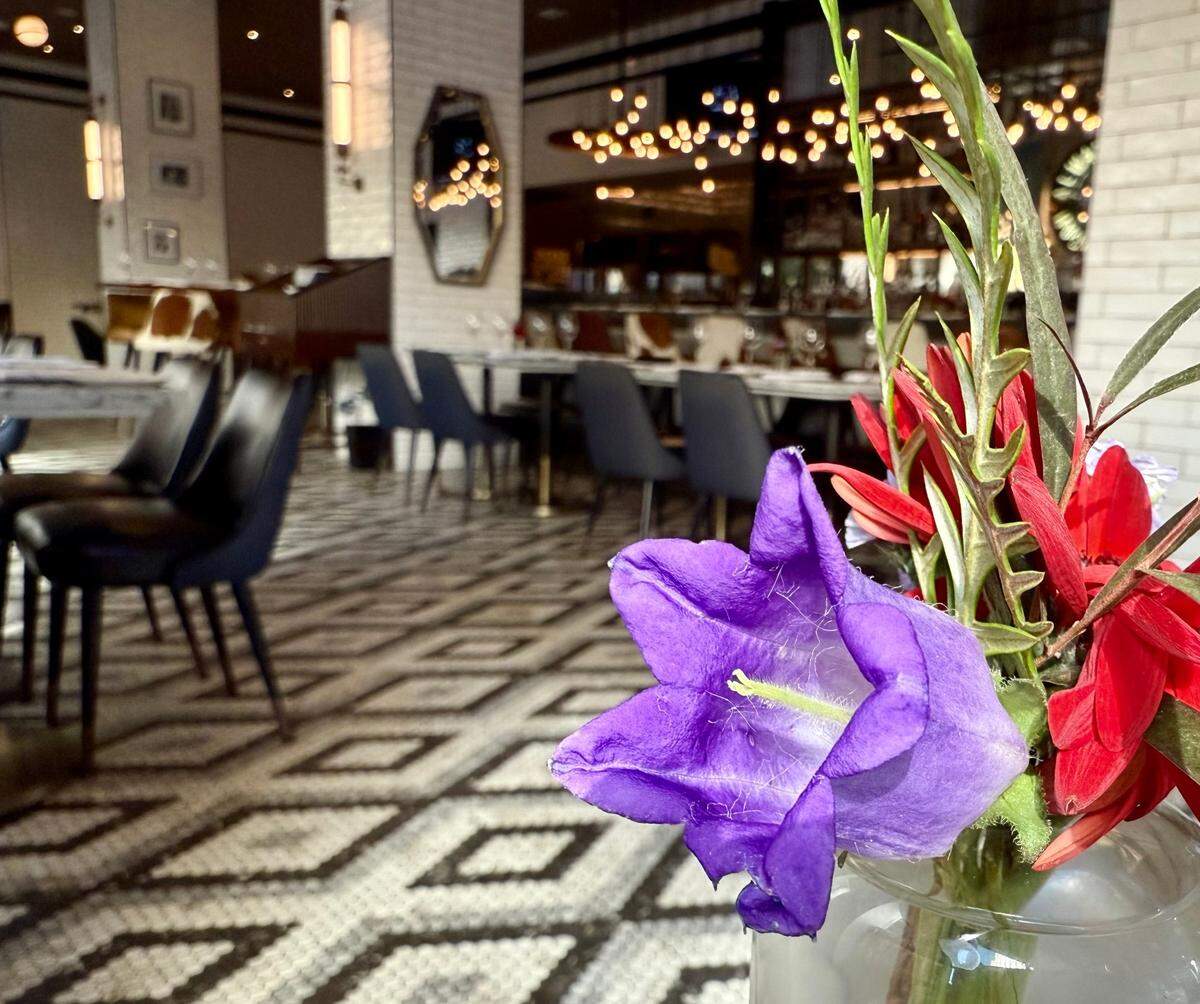 The Wicked Butcher steakhouse serves breakfast and lunch in a first-floor corner cafe on Main Street, seen Dec. 3, 2024, above the cozy basement dining room.
