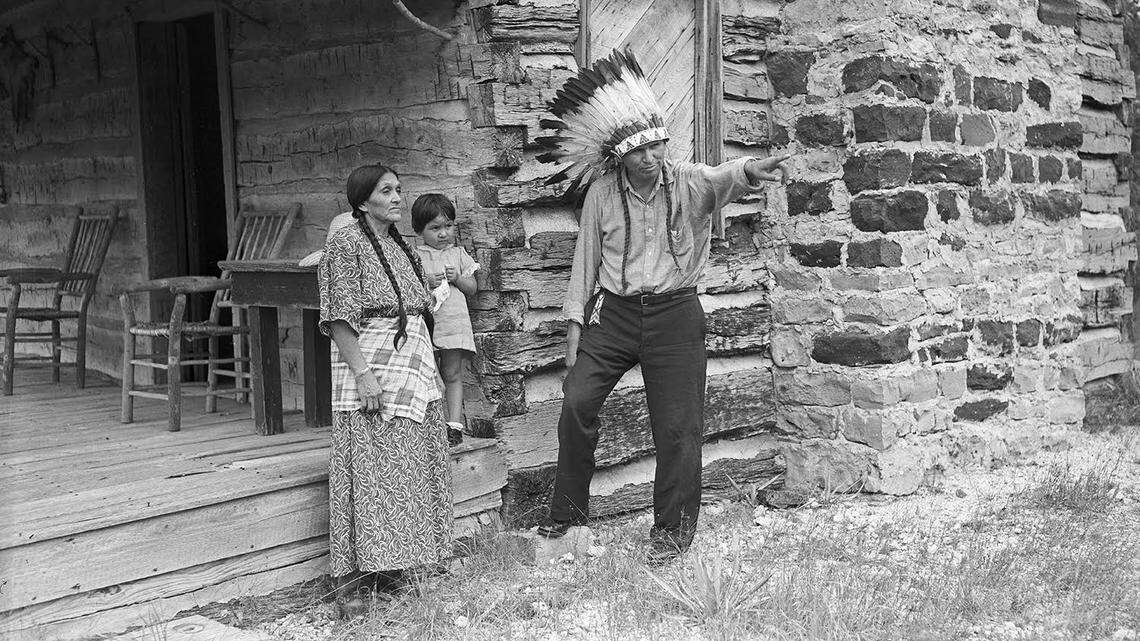 Cynthia Ann Parker, age 3, was the third girl named for her great-great grandmother, Cynthia Ann Parker. She is standing on the steps of the Isaac Parker log cabin between her grandparents, Nora and Baldwin Parker. The family was in Fort Worth for the 1936 Frontier Centennial.