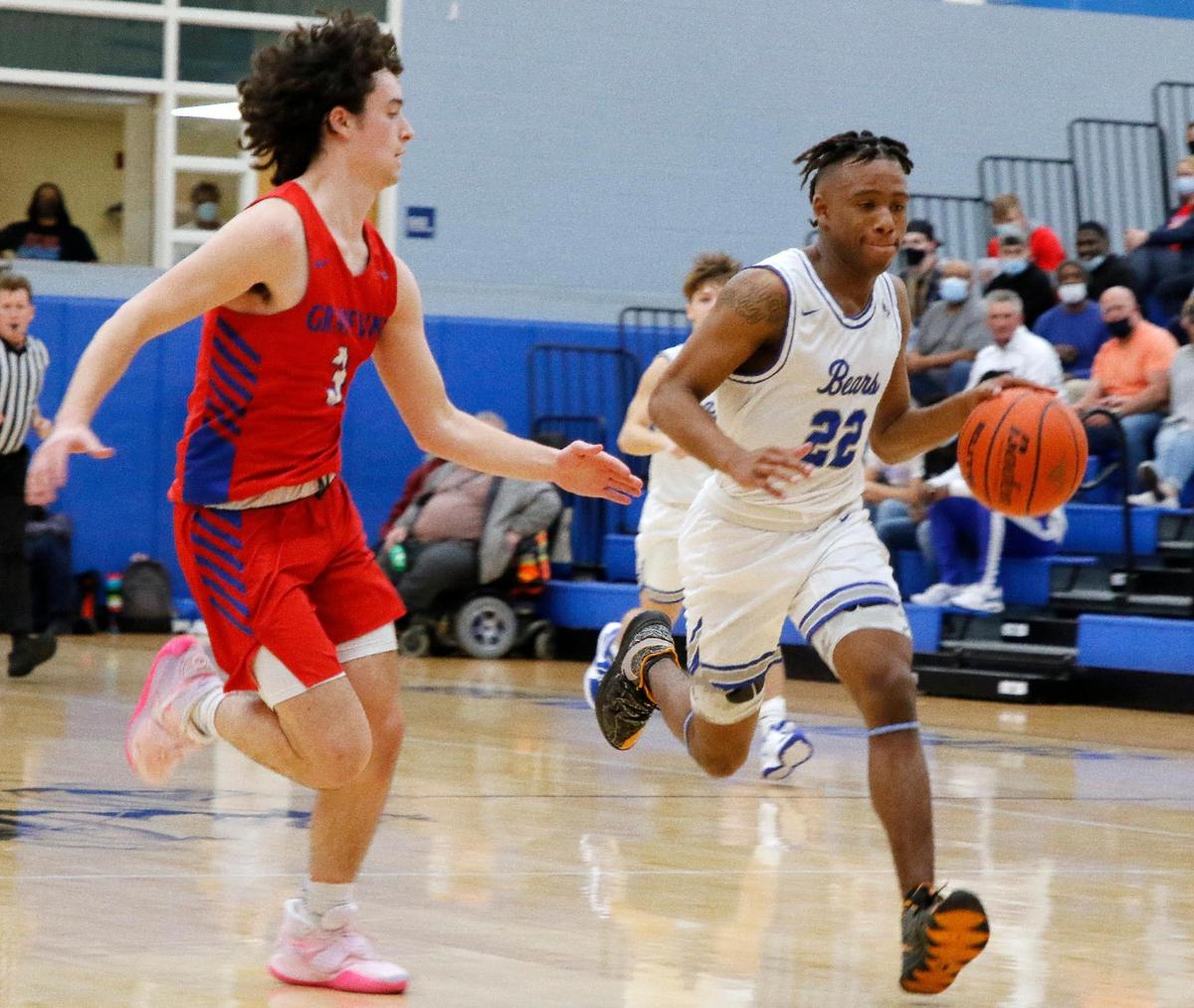 Brewer guard BJ Williams (22) comes down court defended by Grapevine guard Mitch Williams (3) during the second half of a 5A Region 1 bi-district basketball game at Brewer High School in Fort Worth, Texas, Monday, Feb. 22, 2021. Grapevine defeated Brewer 54-46. (Special to the Star-Telegram Bob Booth)