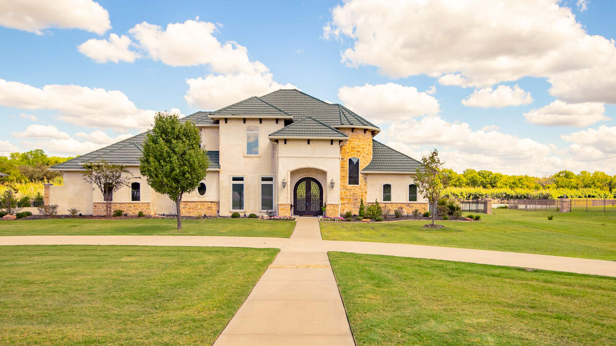 The home at 138 The Lakes Drive is situated on a 2.4-acre lake-front lot.