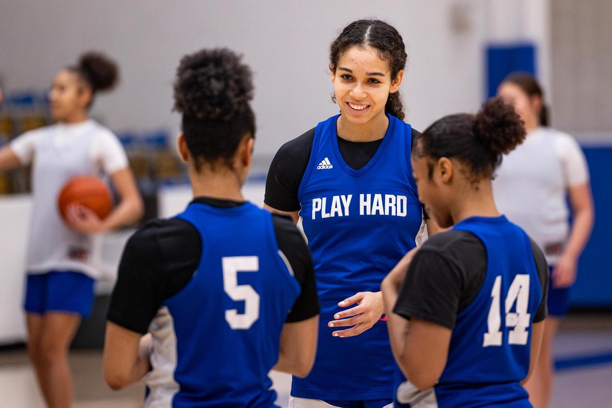 Boswell senior Camille Williams shares a laugh with her teammates during a scrimmage in practice at the Boswell High School gymnasium in Fort Worth on Wednesday, Jan. 29, 2025.