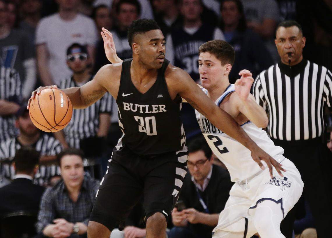 Villanova's Collin Gillespie, right, defends Butler's Kelan Martin during a game in the Big East tournament in New York City.