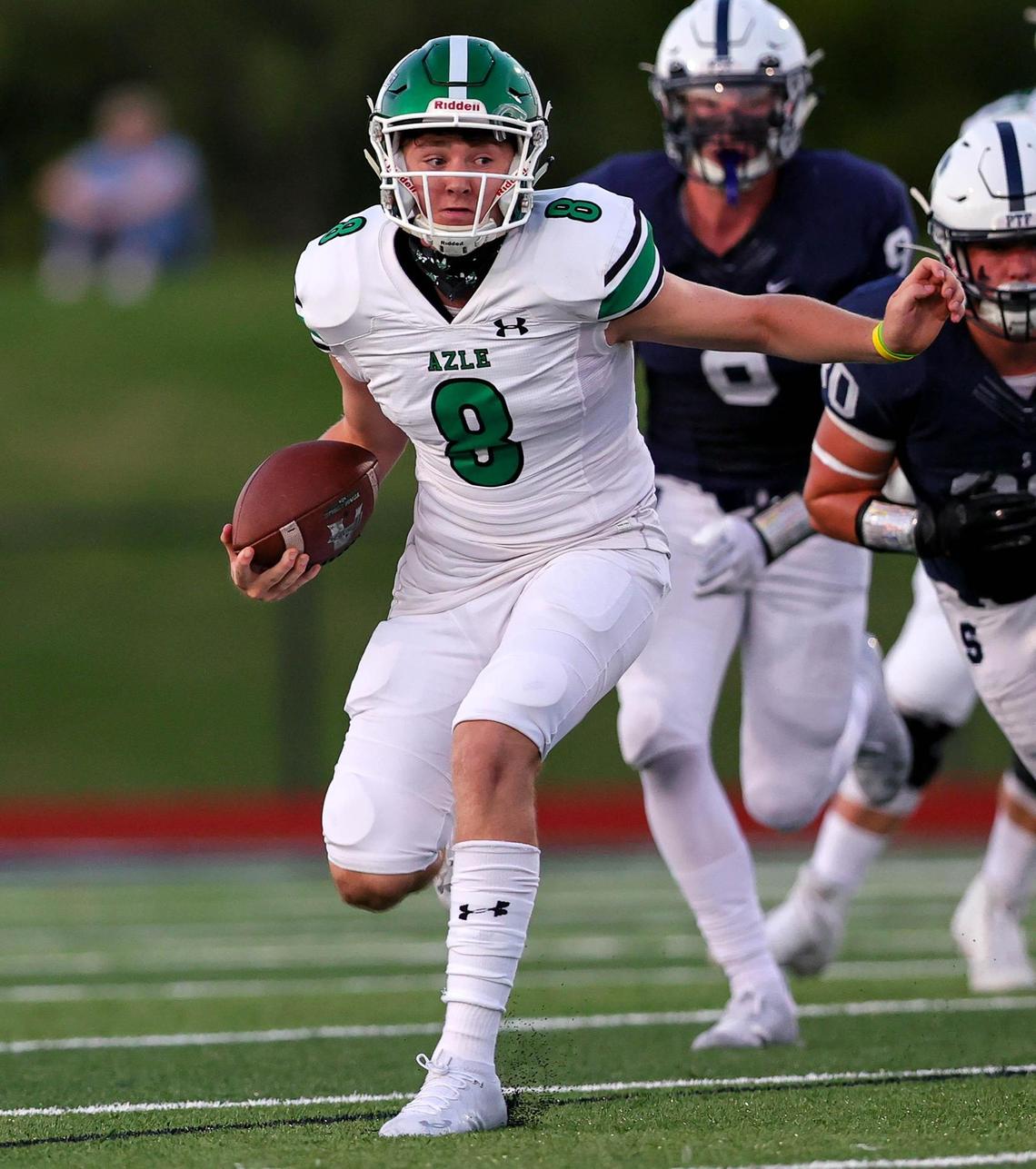 Azle quarterback Chris Lee (8) looks for room to run against All Saints during the first half, Friday night, September 25, 2020 played at All Saints High School in Fort Worth, TX. (Steve Nurenberg Special to the Star-Telegram)