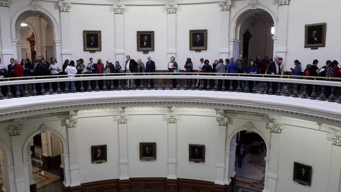 Visitors and guests line up in the rotunda of the Texas State Capitol to enter the House Chamber for the beginning of the 86th Texas Legislative session.