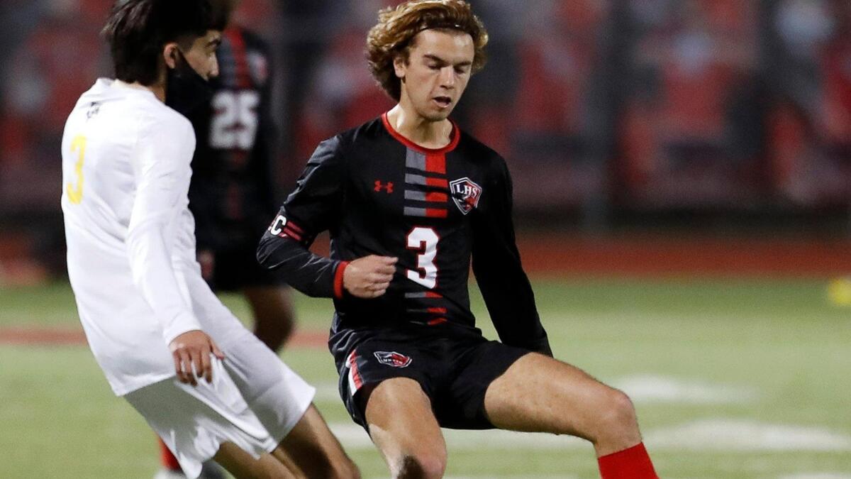 Everman’s Erubiel Acevedo defends against Legacy’s Jacob Stillings during a district 8-5A high school soccer game at Mansfield Legacy High School in Mansfield, Texas, Wednesday, March 03, 2021. Legacy defeated Everman 5-1. (Special to the Star-Telegram Bob Booth)