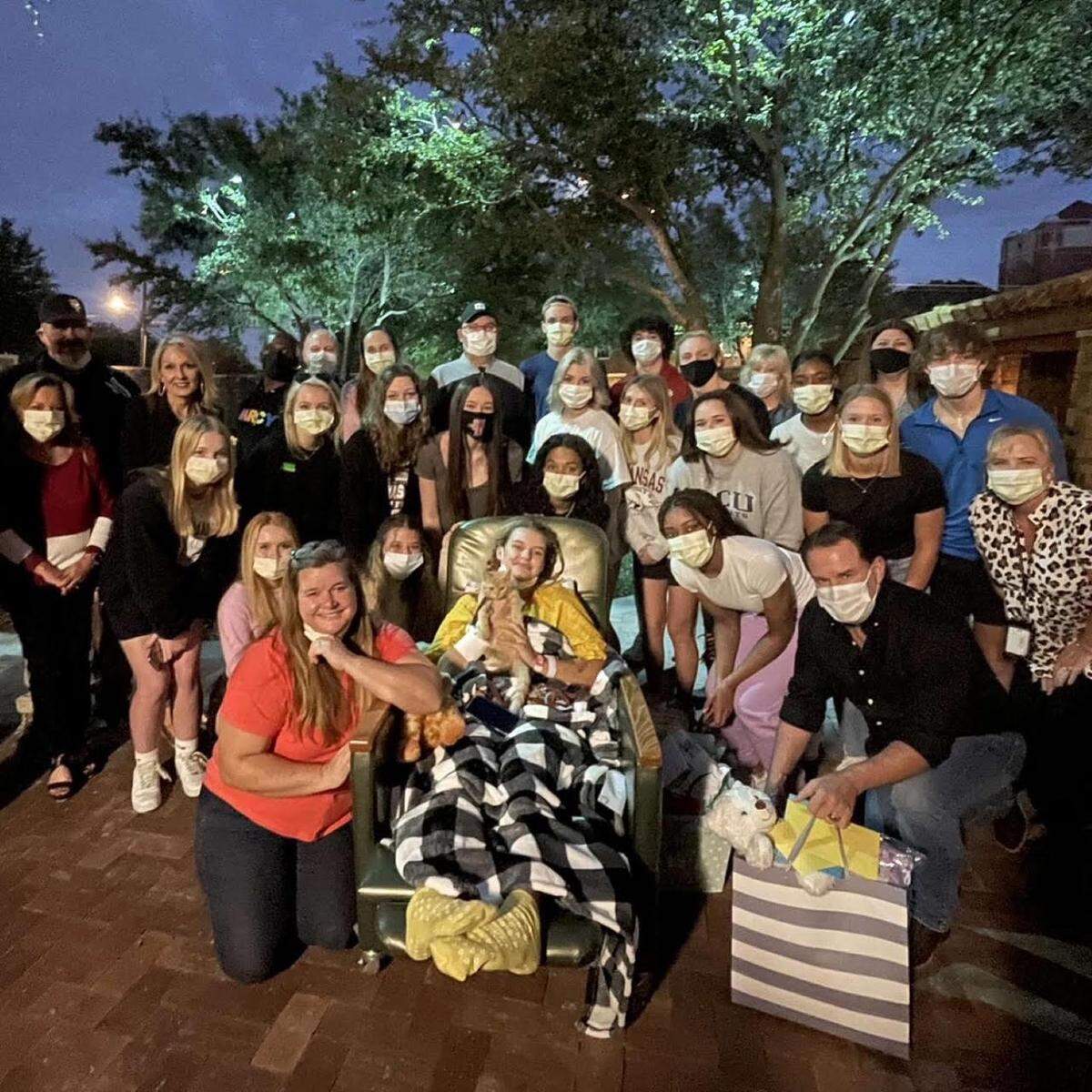 Mansfield Legacy’s Savannah Stewart pictured with teammates and friends while recovering from a car crash in November (Sherrie Stewart/Courtesy)