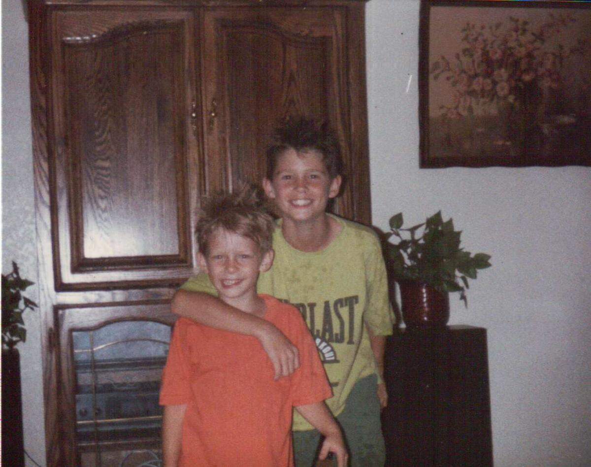Jordan Hightower (left) poses for a photo with his older brother, Zach Hightower (right), in this family photo. Their father said on Thursday morning he was relieved after Arlington police arrested a suspect in Jordan’s murder.