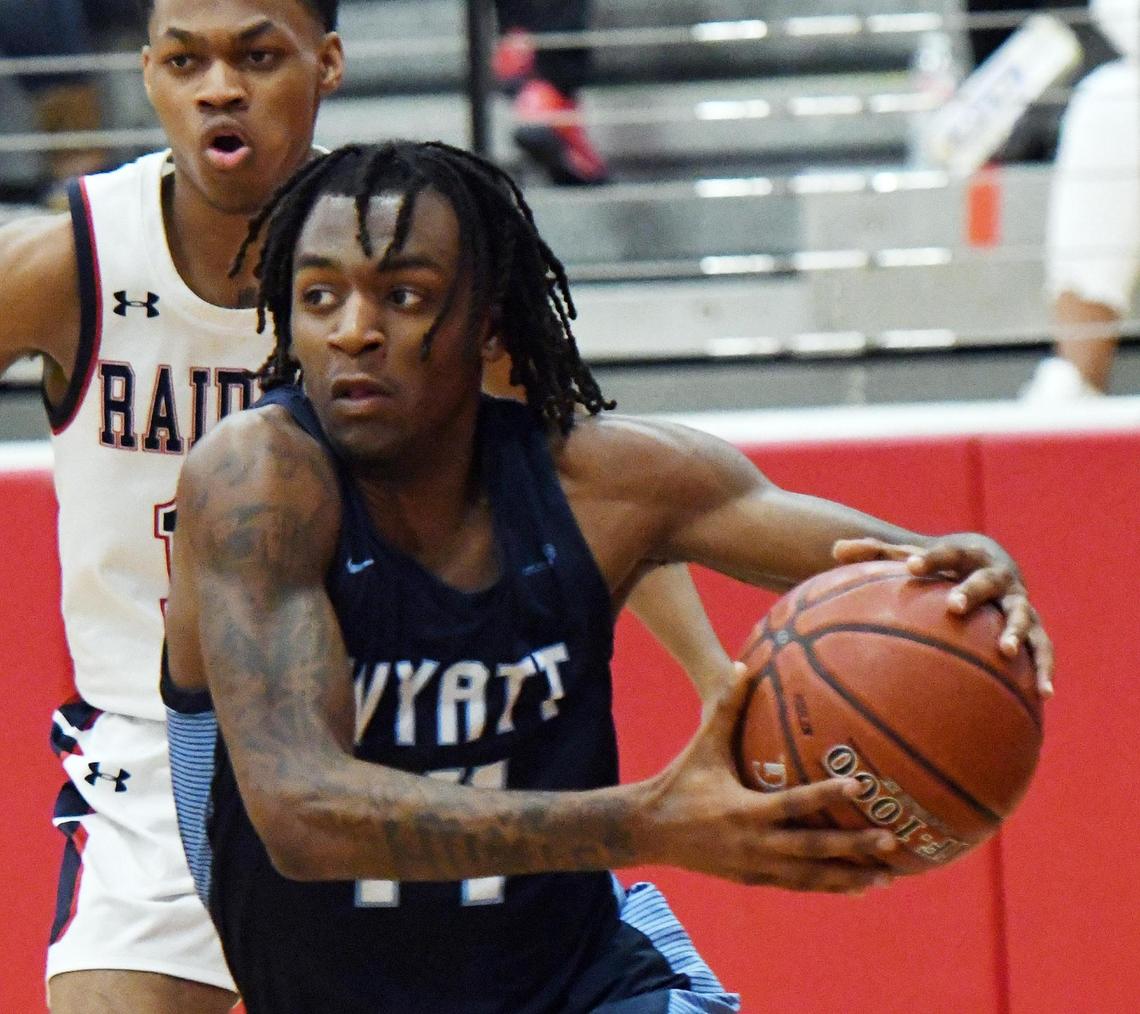O.D. Wyatt’s Bobby Flowers, front drives to the basket past Ryan’s Chris Smith in the first period of their 5A Region I Area playoff game Thursday, February 25, 2021 at Colleyville Heritage High School in Colleyville, Texas. Wyatt went on to win 59-44. Special/Bob Haynes