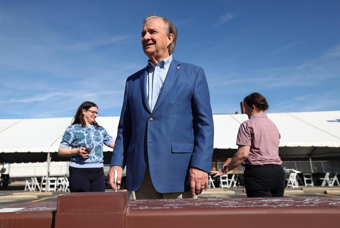 Texas A&M University Chancellor John Sharp signs his name to the final beam during a topping out ceremony for the Texas A&M-Fort Worth Law and Education Building currently under construction on Monday, Nov. 11, 2024.