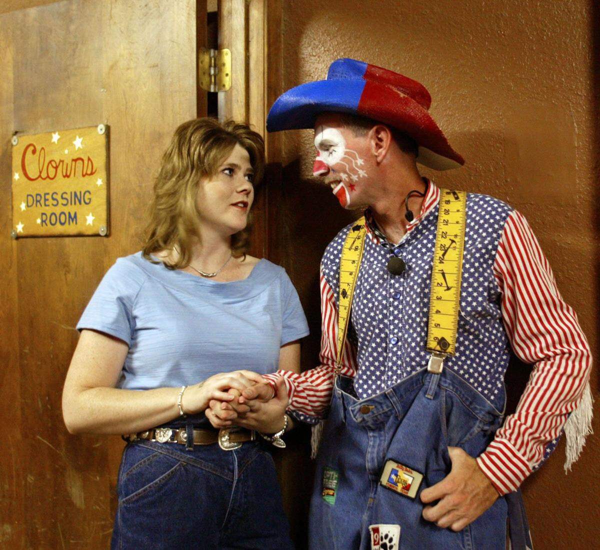 July 31, 2004: Fort Worth resident Crystal Jones chats with rodeo clown and barrel man Jeff Harris, outside his dressing room at Billy Bob’s Texas in Fort Worth.