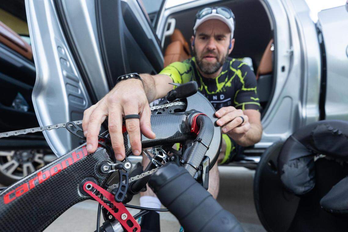 Trent Fielder adjusts his bike before he heads out for a 100-mile ride on the Trinity Trails on April 26, 2022, in Fort Worth.