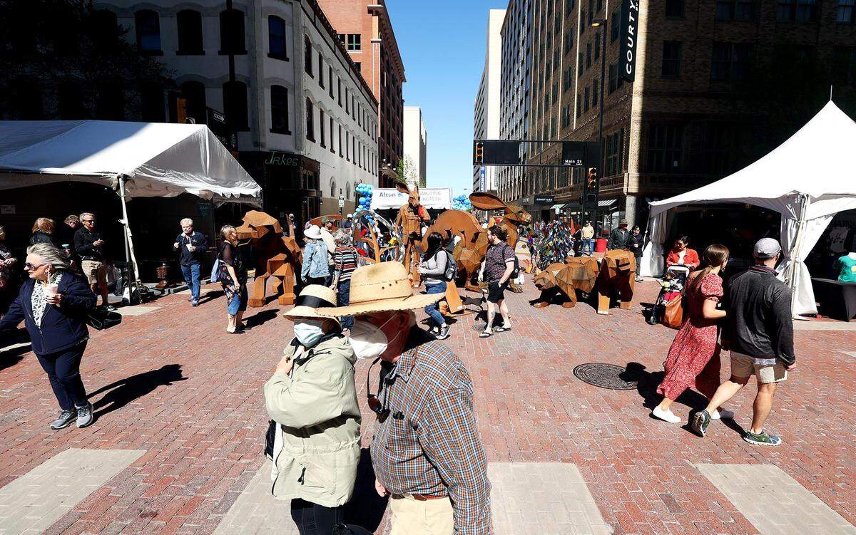 Visitors to the Main Street Arts Festival crowd Main Street in downtown Fort Worth on Friday. The Fort Worth Art Fair was also taking place at Sundance Square Plaza.