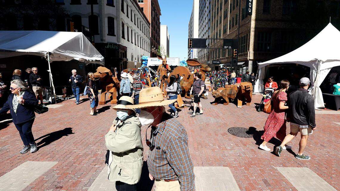 Visitors to the Main Street Arts Festival crowd Main Street in downtown Fort Worth on Friday, April 8, 2022. The Fort Worth Art Fair was also taking place at Sundance Square Plaza.