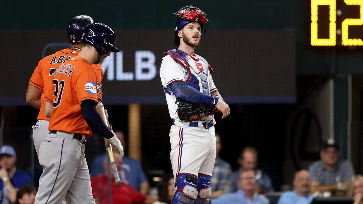 Texas Rangers catcher Jonah Heim reacts after the Houston Astros hit a three-run homer during Game 4 of the ALCS at Globe Life Field in Arlington on Thursday, October 19, 2023.