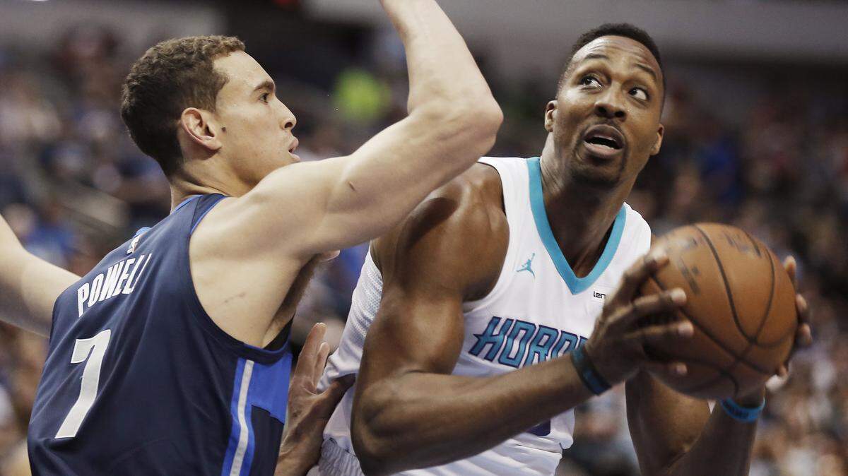Charlotte Hornets forward Dwight Howard looks for a shot against Dallas Mavericks forward Dwight Powell (7) during the first half of Saturday's NBA game in Dallas.
