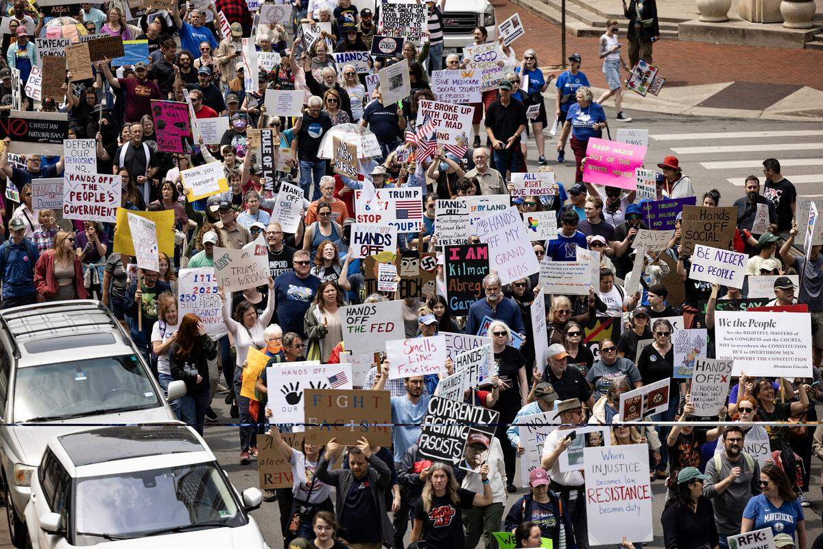 Thousands of protestors march down W 5th Street for the national ‘Hands Off’ protest movement in downtown Fort Worth on Saturday, April 19, 2025.