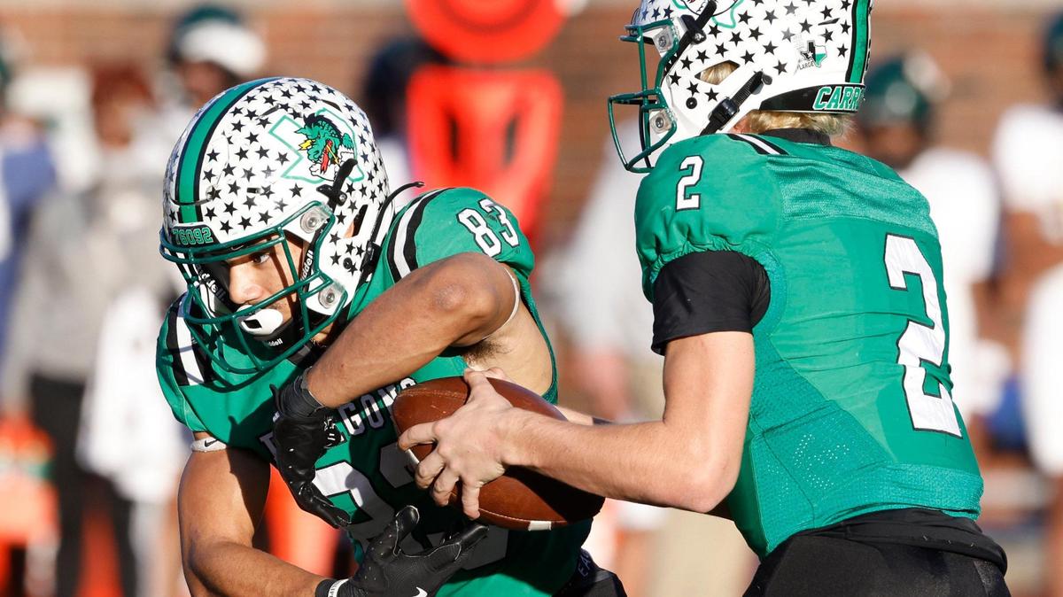 Southlake Carroll quarterback Angelo Renda (2) pulls the ball back from running back Christian Glenn (83) and throws to the flat against Longview during the UIL 6A D2 Semifinals at Gerald J. Ford Stadium in University Park, Texas, Saturday, Dec. 14, 2024.