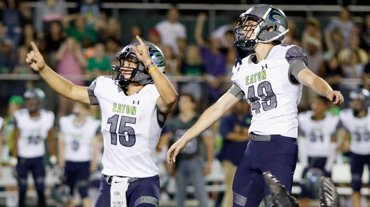 Eaton kicker Dakota Lamb (49) and holder Braden St Ama (15) celebrate as the winning field goal goes through in overtime. Eaton beat Timber Creek 23-20. The Eaton Eagles played the the Timber Creek Falcons at Keller ISD Stadium Thursday, September 26, 2019