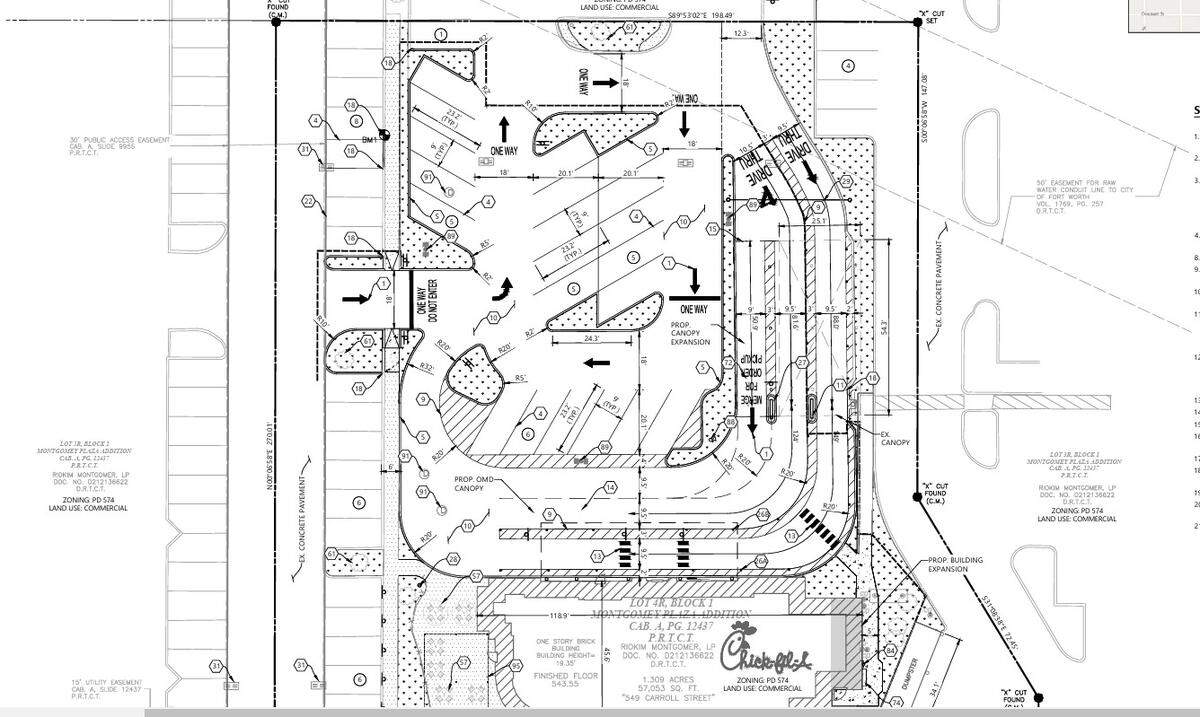 This rendering shows a proposed reconfiguration of the Chick-fil-A drive-through area at the restaurant in Montgomery Plaza off West Seventh Street. A third lane would be added for taking orders, and a second lane for food delivery.